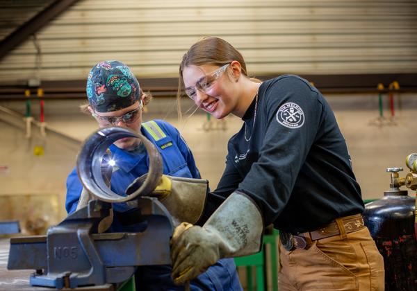 a VIU instructor works with a student. 
