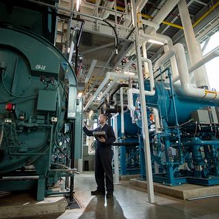 Man working on large equipment