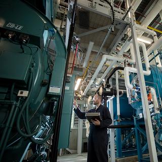 Man working on large equipment